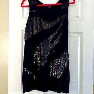 Chic Black dress with embellishment across front.